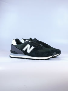 NEW BALANCE - SCARPA DA GINNASTICA DA UOMO CLASSIC 574 NERA CON DETTAGLI BIANCHI KN2